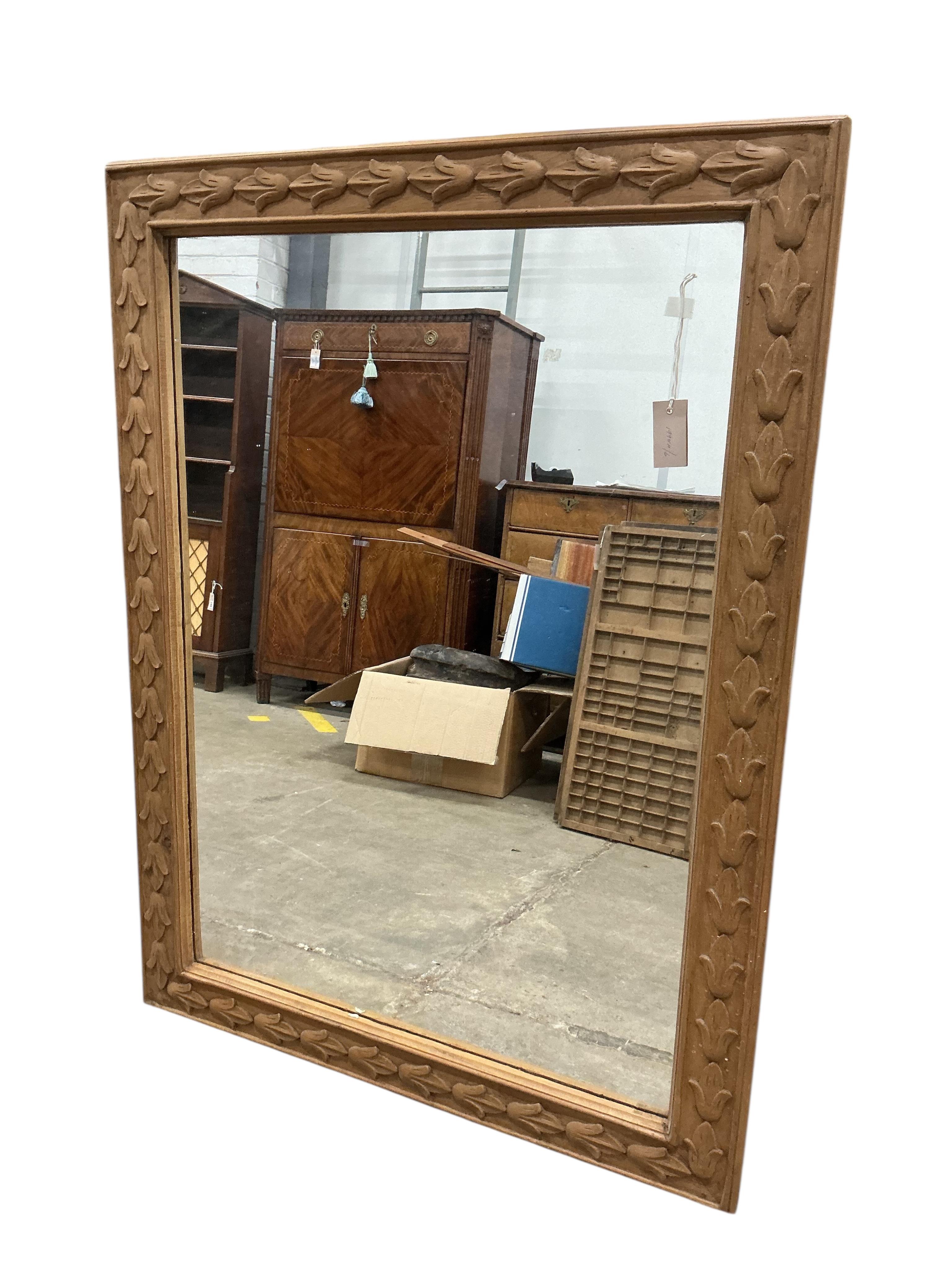 A rectangular carved pine overmantel mirror, width 122cm, height 92cm